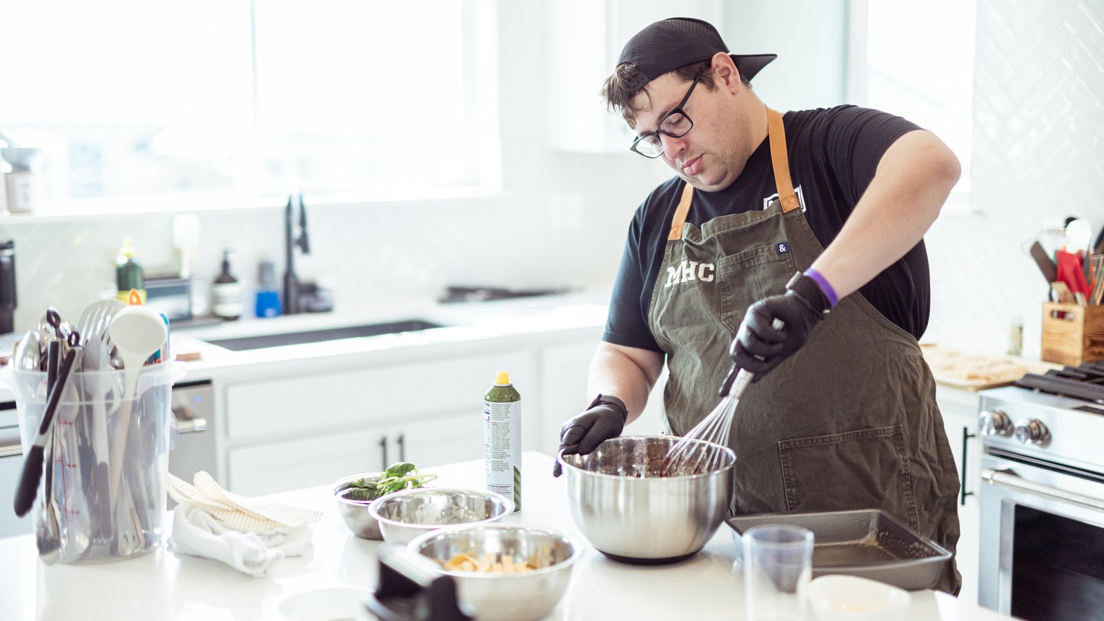 Chef plating a course of an omakase tasting menu at the Aspen Food and Wine Classic