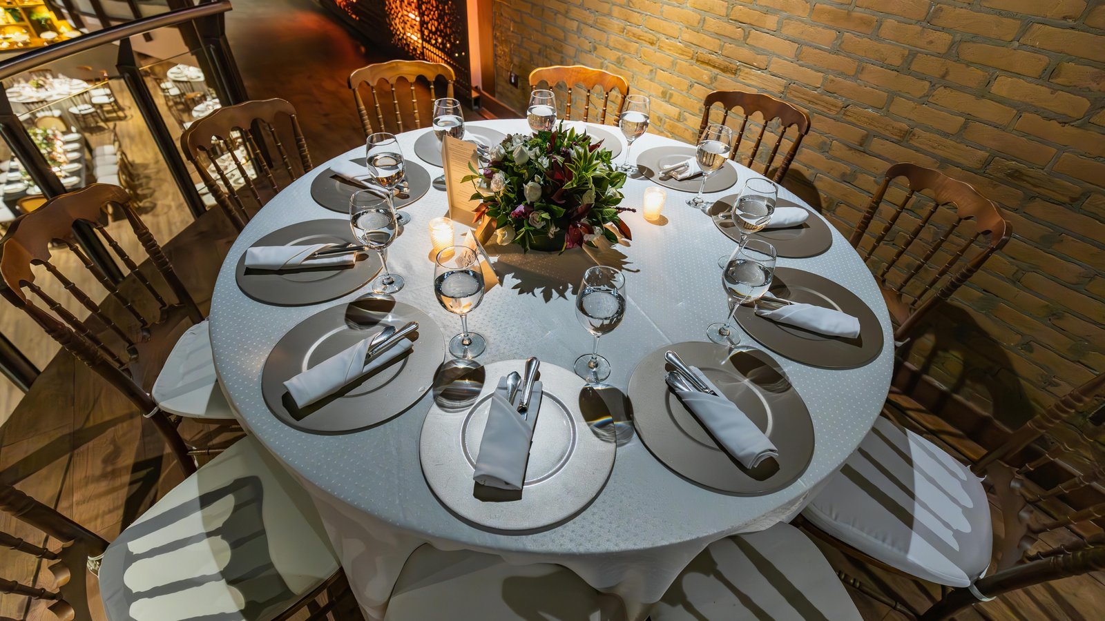An elegantly plated multi-course dinner service for an intimate gathering in a mountain venue.
