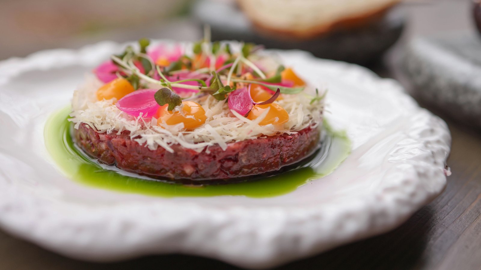 Elegant plated desert cuisine with Sonoran ingredients on a Scottsdale estate terrace at sunset.