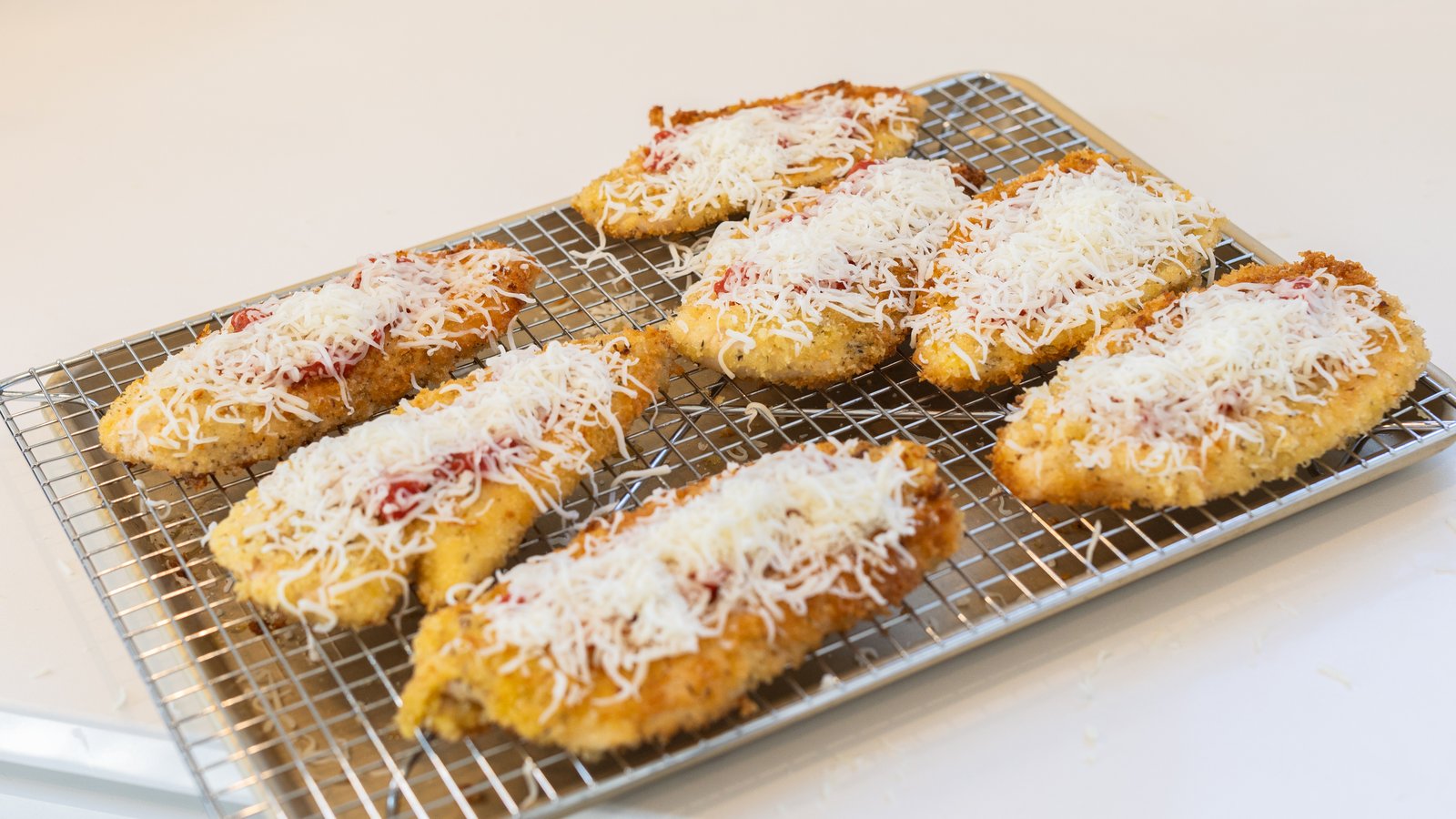 Artisan pastries dusted with powdered sugar arranged for a wedding-weekend brunch in Boulder.