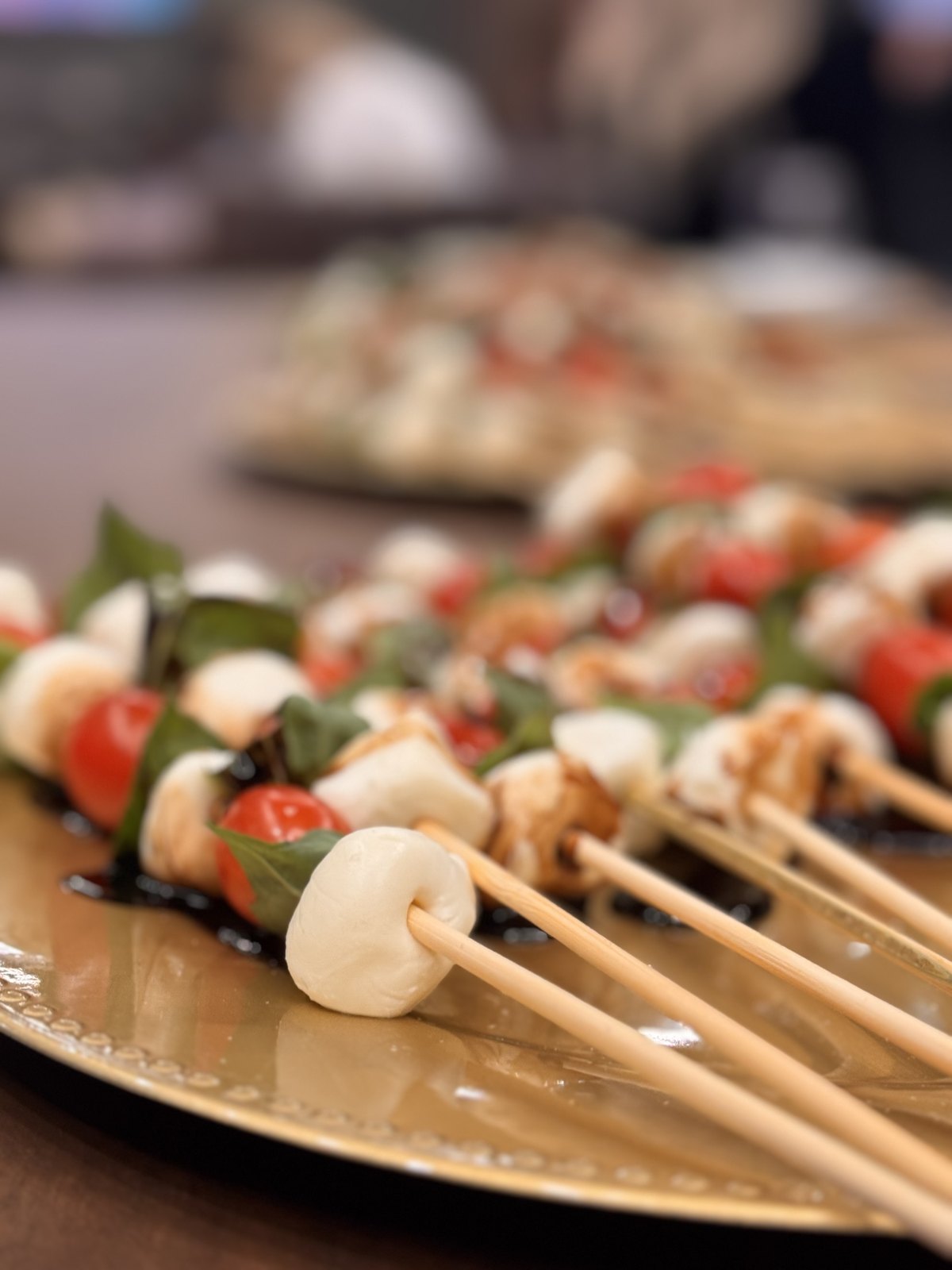 Caprese skewers on a serving platter