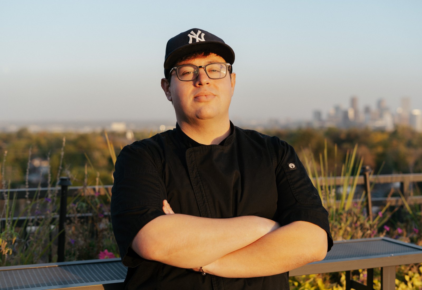 Executive Chef Steve Ingber with the Denver skyline behind