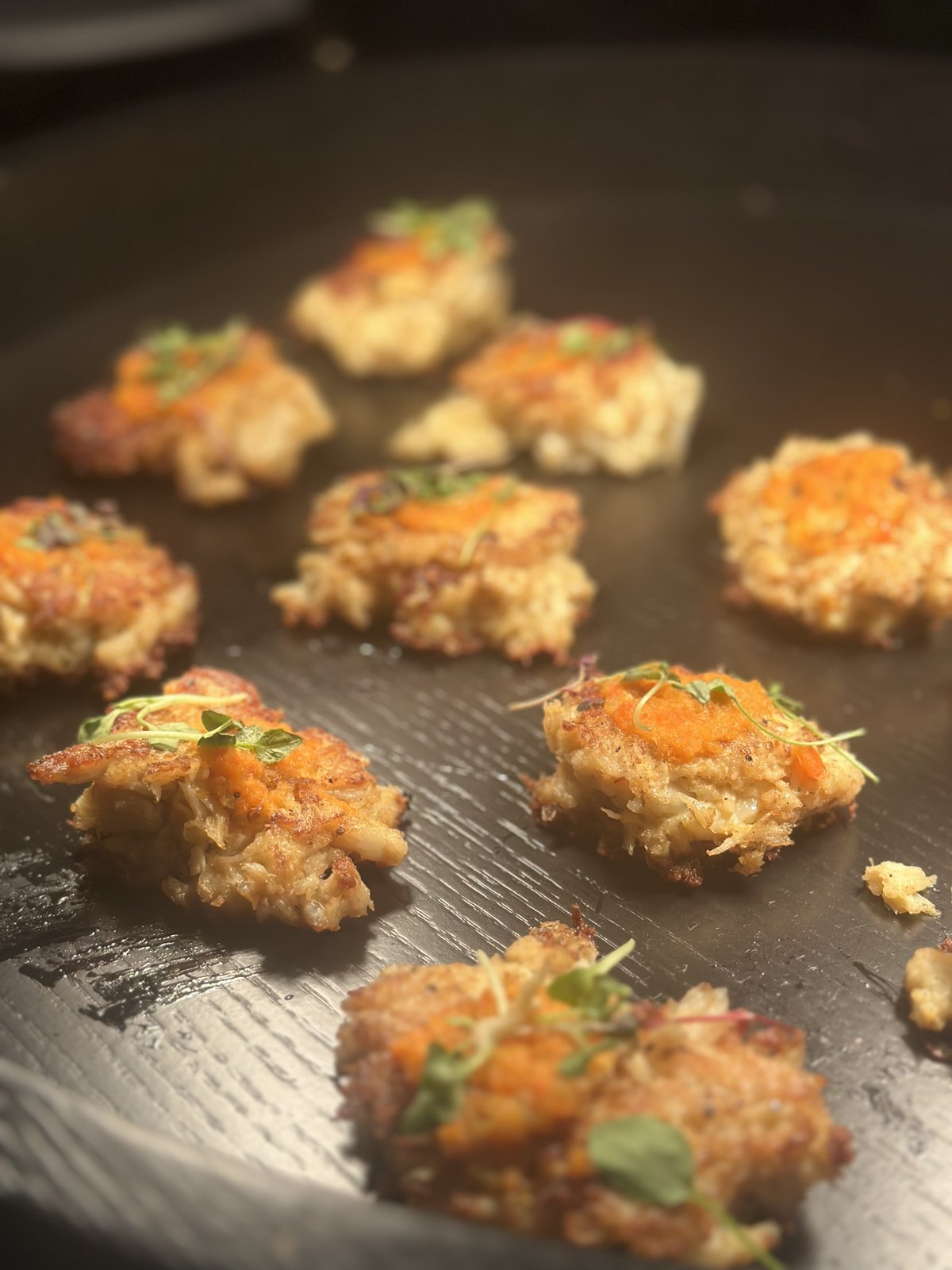 Crab cakes finishing on the griddle