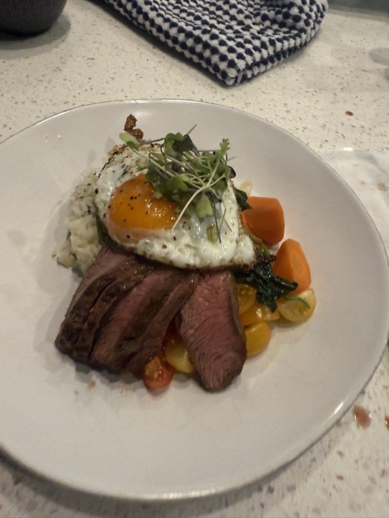 Plated duck breast with roasted vegetables