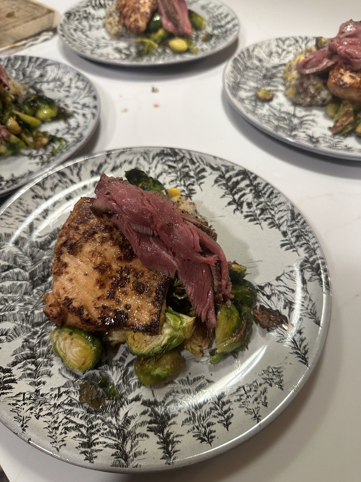 Plated pork with brussels sprouts