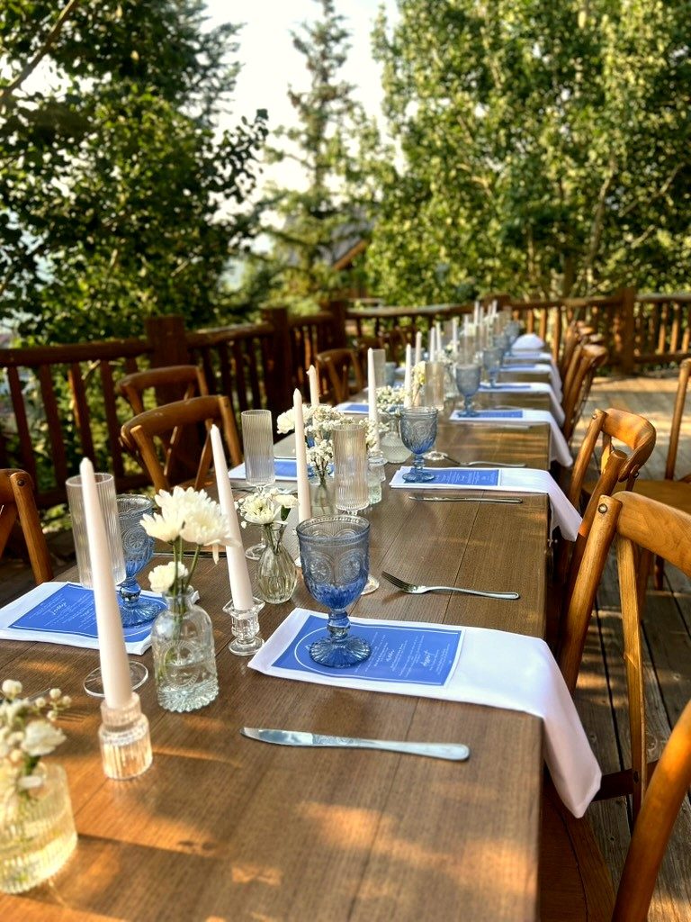 Candlelit estate dinner table set for a private chef mountain wedding