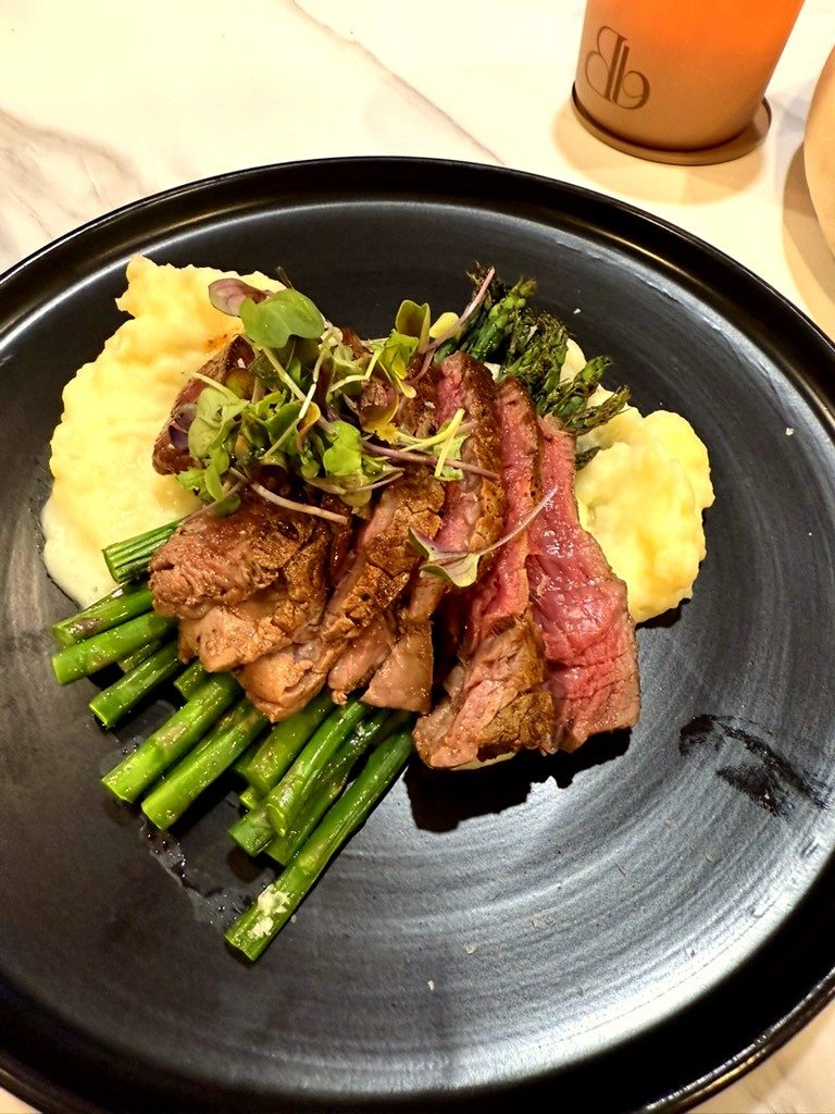 Private chef plated steak with asparagus and truffle mash at a Vail ski chalet dinner