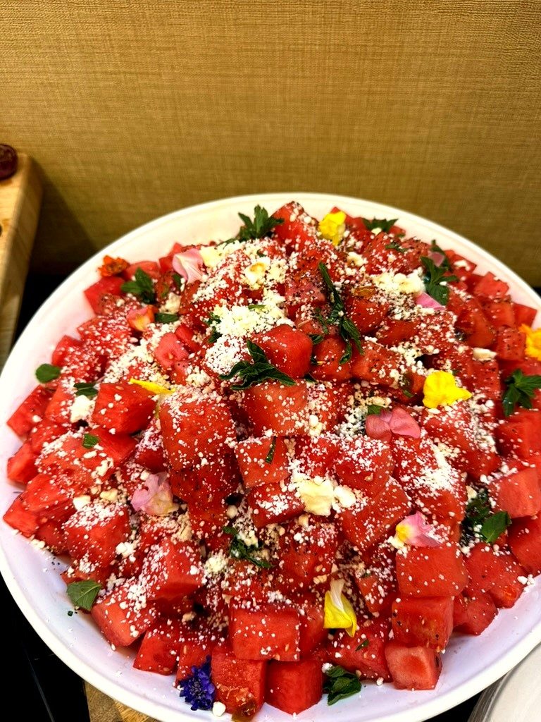 Watermelon and feta salad plated for a luxury private chef event